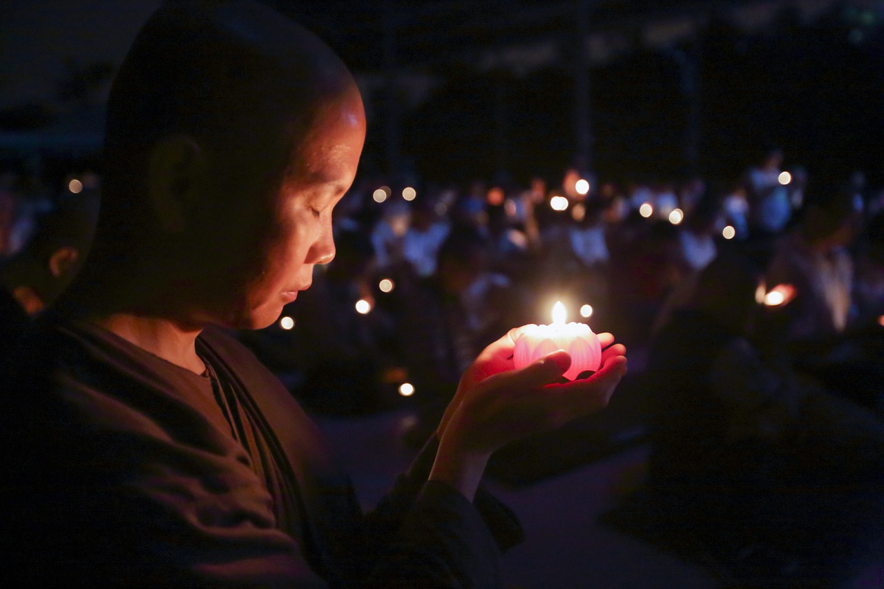 nun with candle theravada buddhism making aspiration free photo
