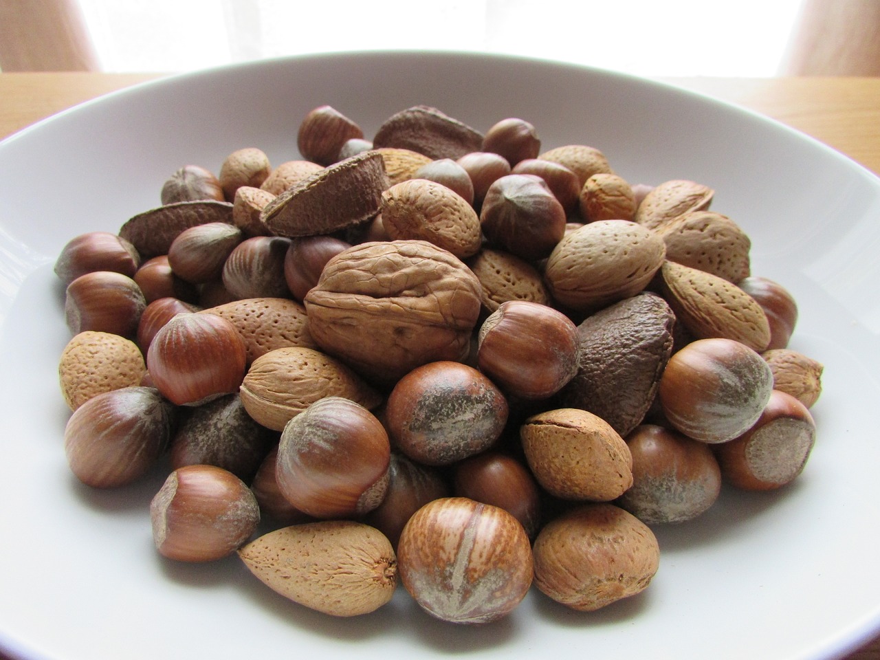 nuts in a bowl christmas nuts nut free photo