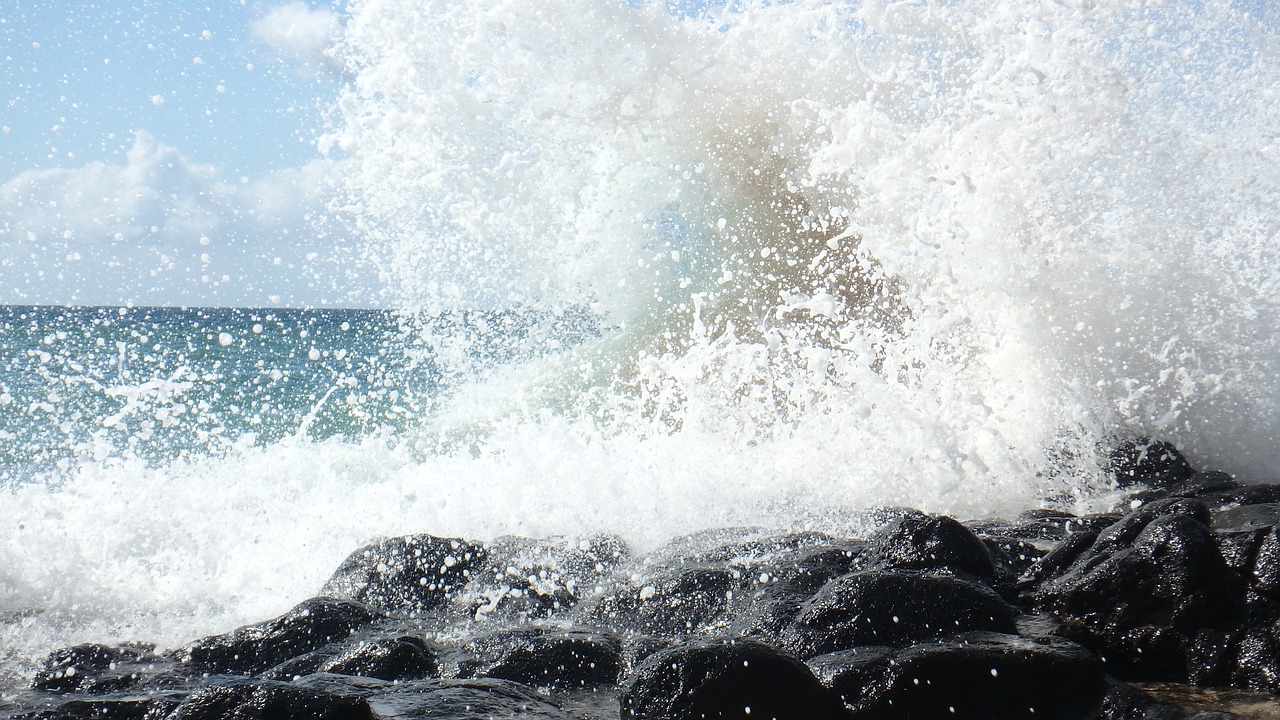ocean black rock splash free photo