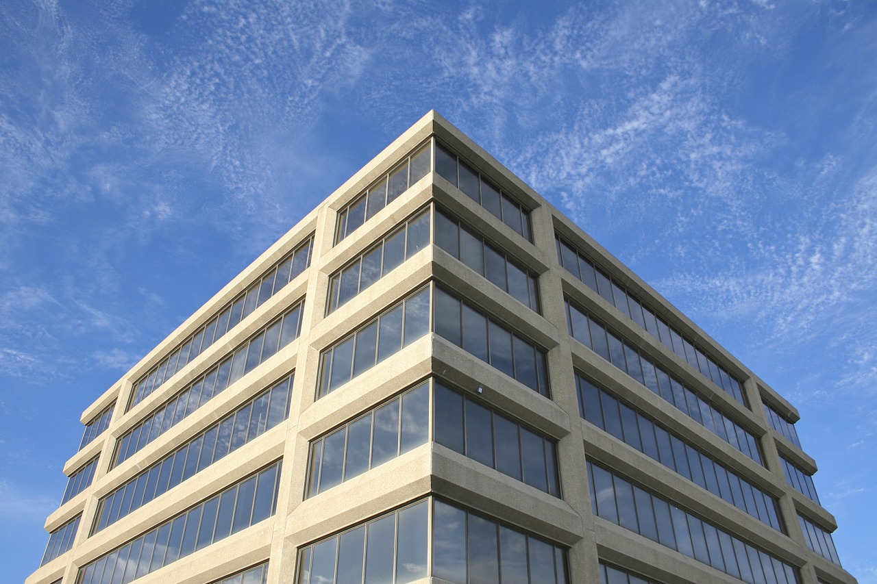 office building blue skies free photo