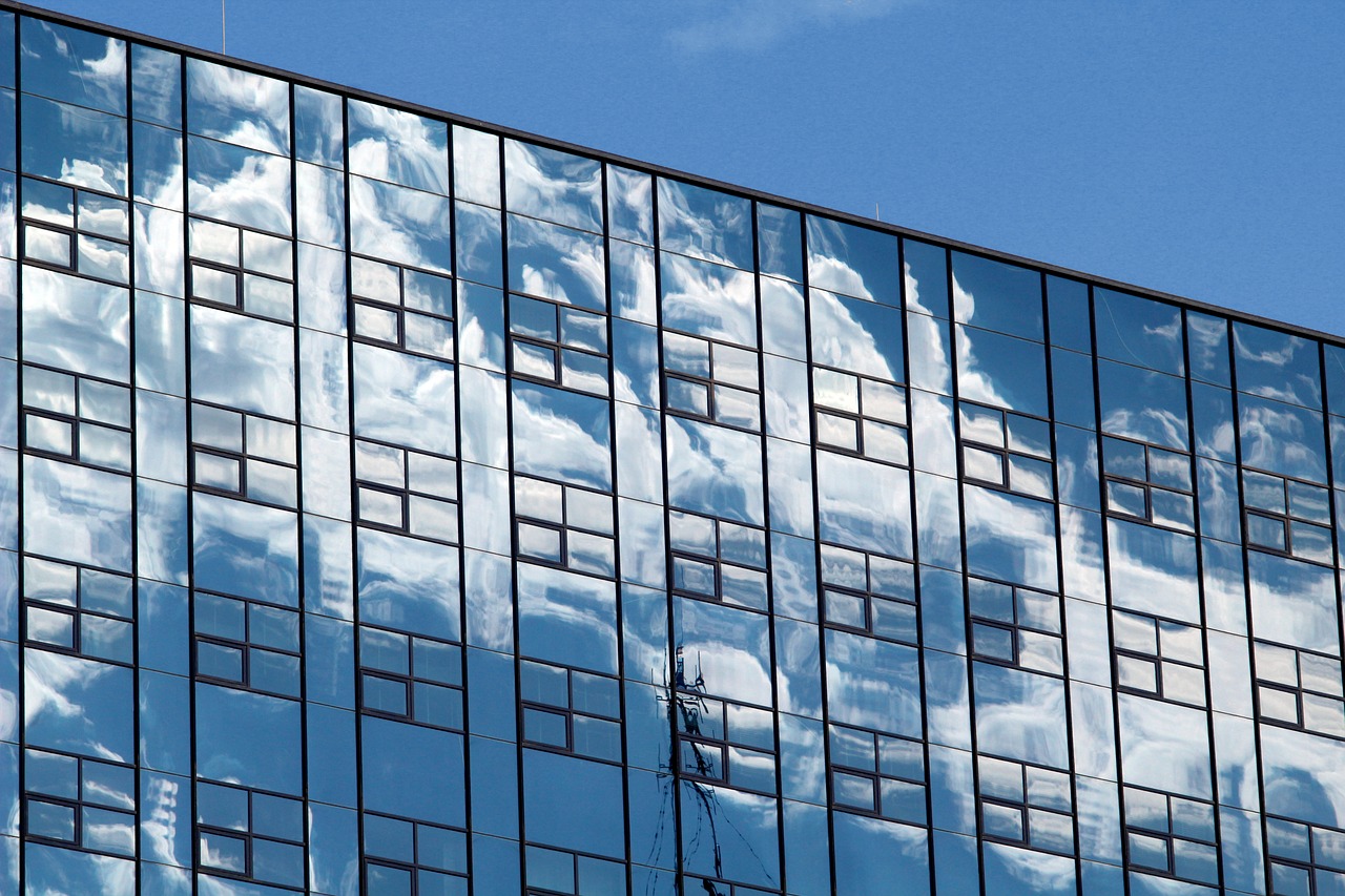 office building  the clouds  reflection free photo