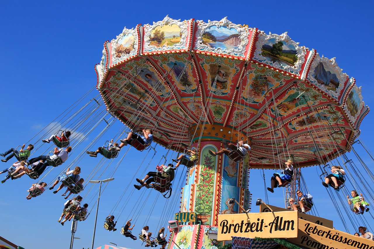 oktoberfest chain carousel blue sky free photo