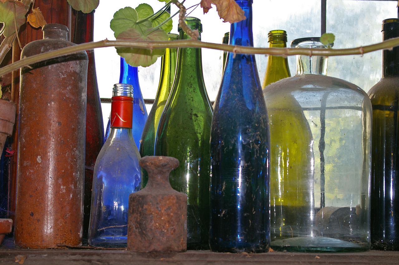 old bottles  dusty  colorful bottles free photo