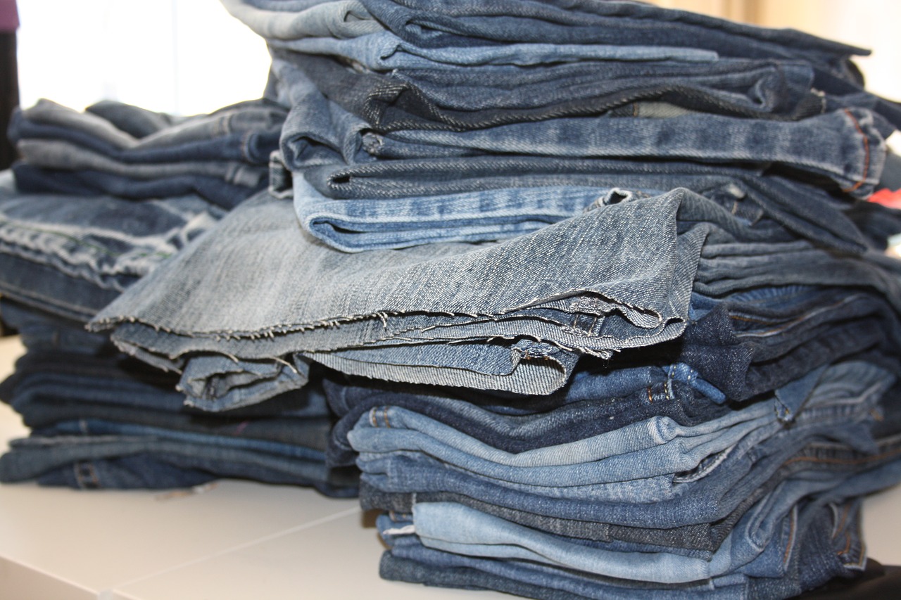 old jeans  pile of jeans  recycling free photo