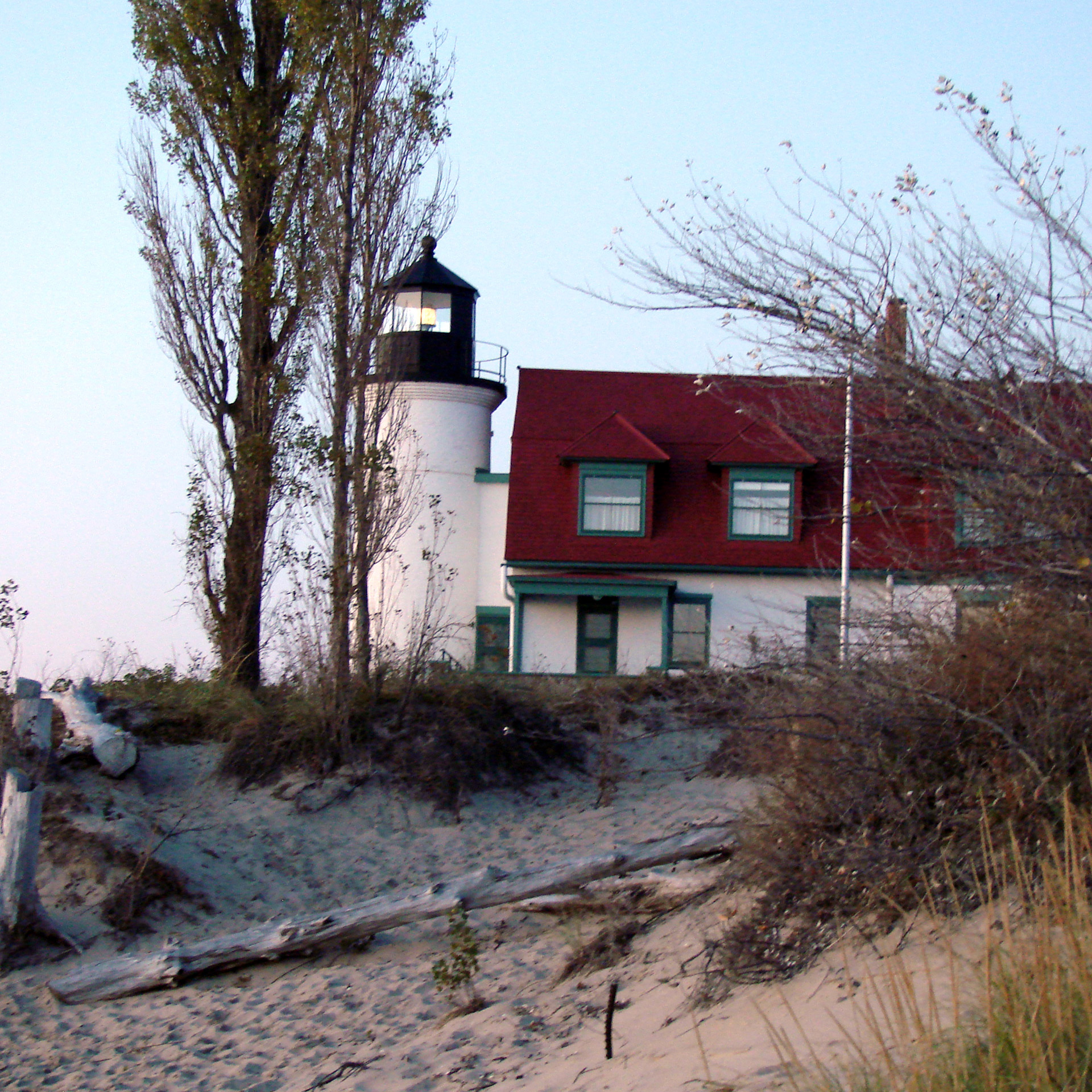 old lighthouse michigan water beach free photo