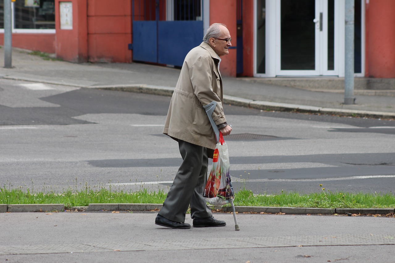 old man crutches senior free photo