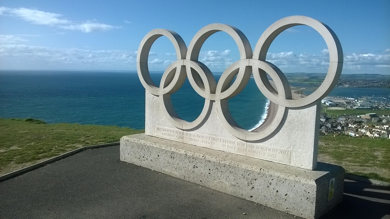olympic rings sea sky free photo