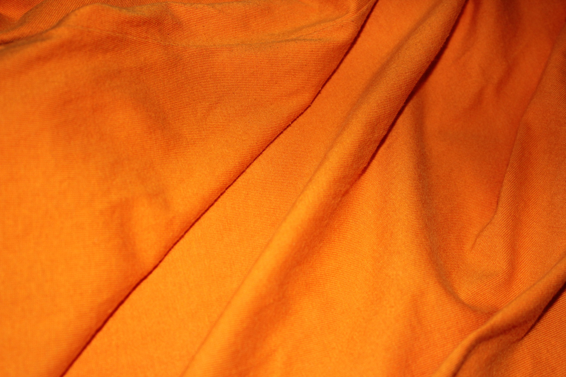 orange textile background background wallpaper free photo