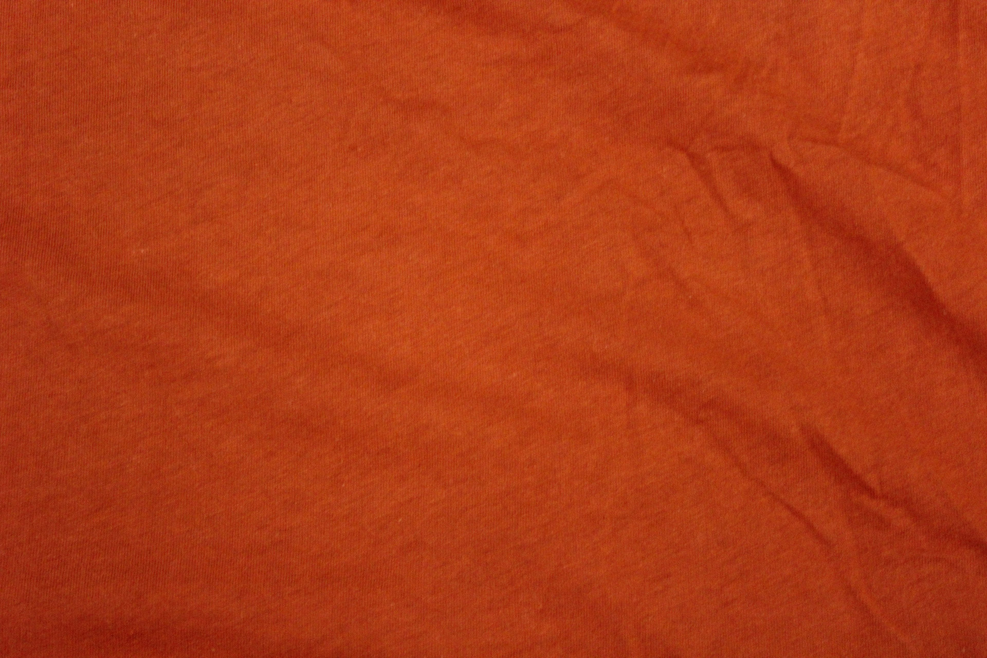 orange textile background orange textile orange cloth free photo