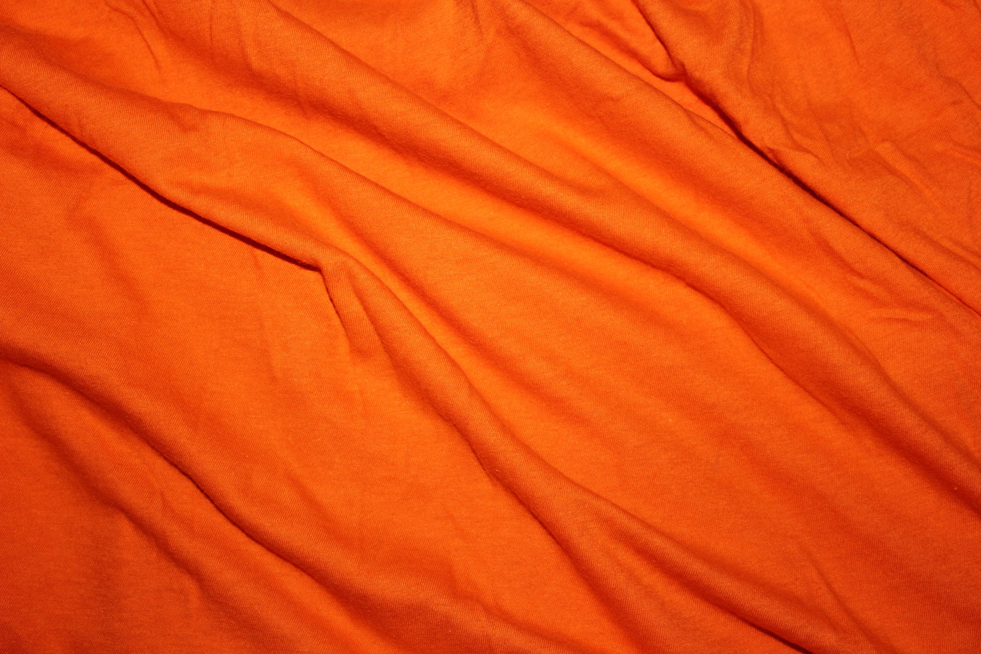 orange textile background orange textile orange cloth free photo