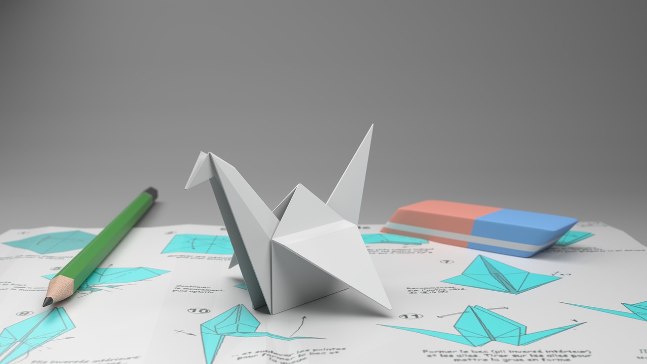 origami crane pencil to paper free photo