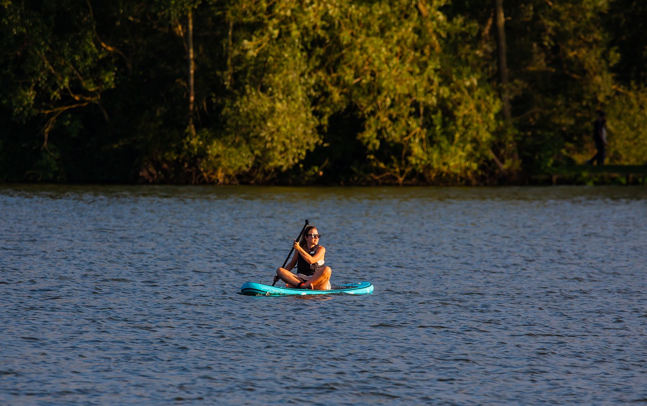 paddle board  woman on paddle board  woman on lake free photo
