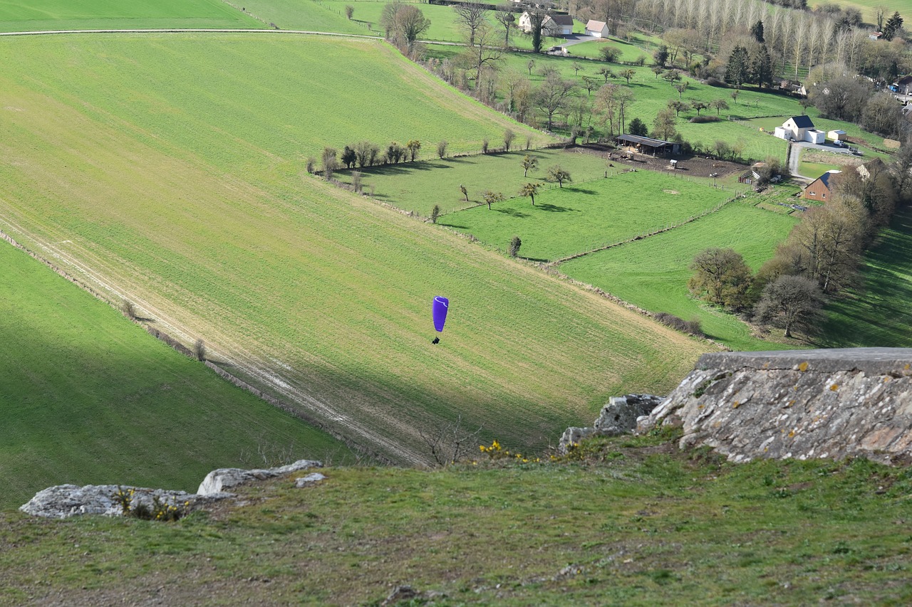 panoramic views  plain  fields landing paragliding free photo