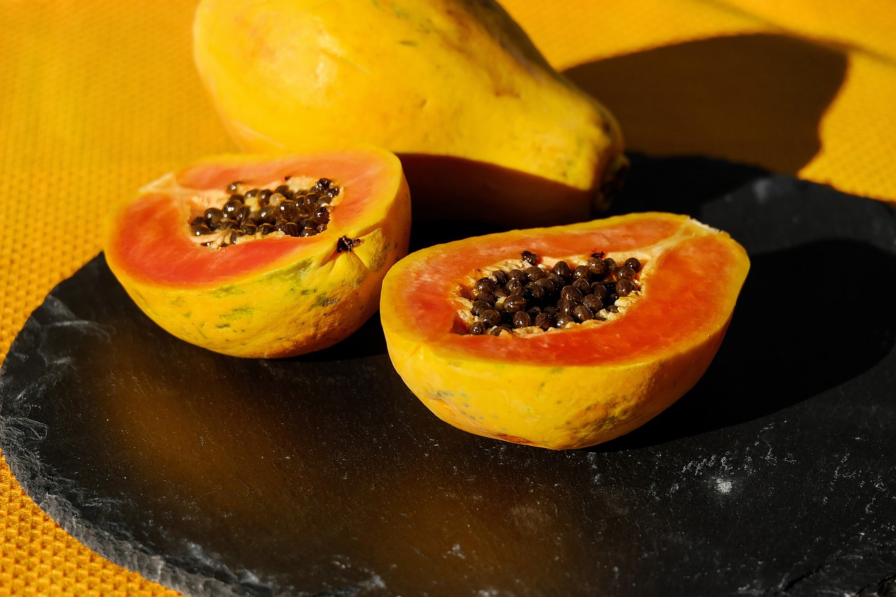 papaya fruit cut in half free photo