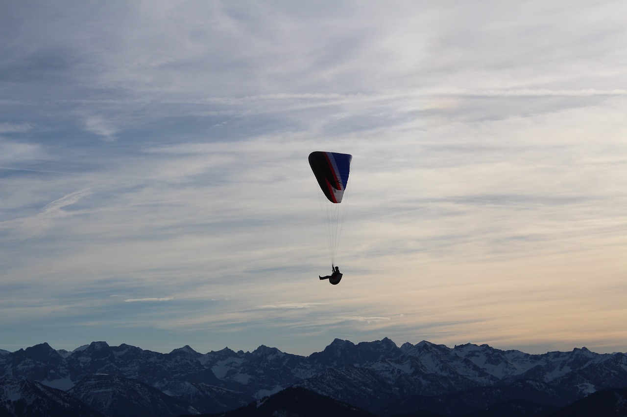 parachutist mountains parachute free photo