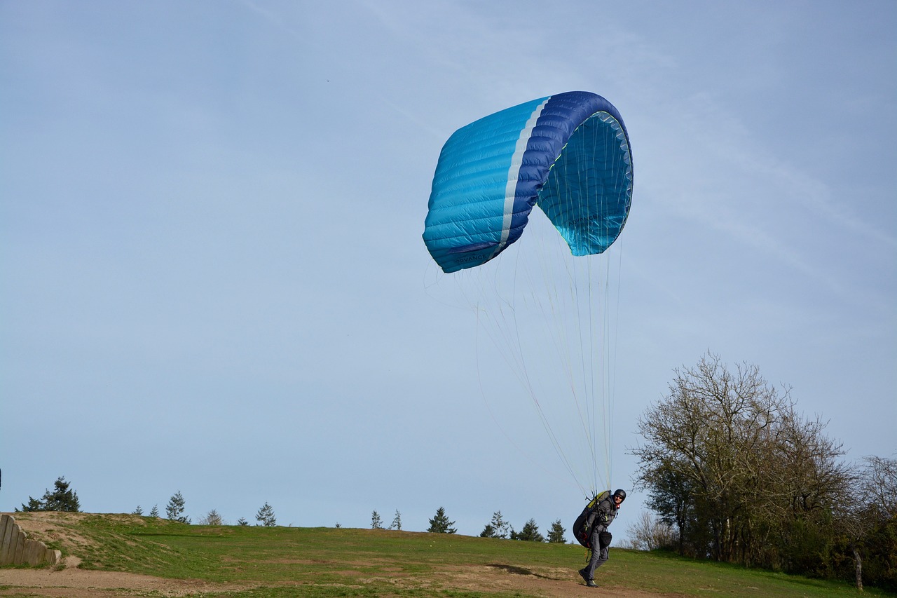 paragliders practice in free flight takes his flies free photo