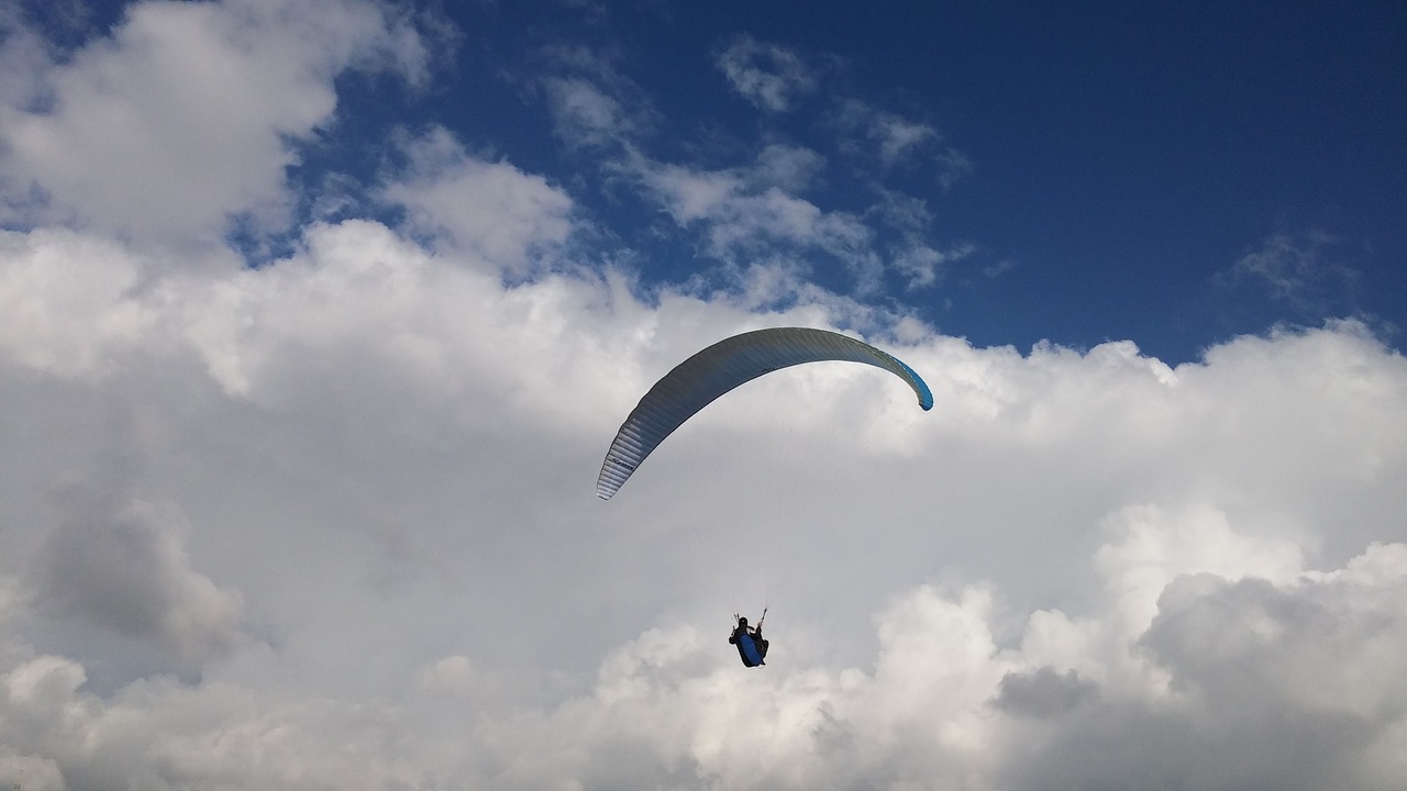 paragliding clouds beach free photo