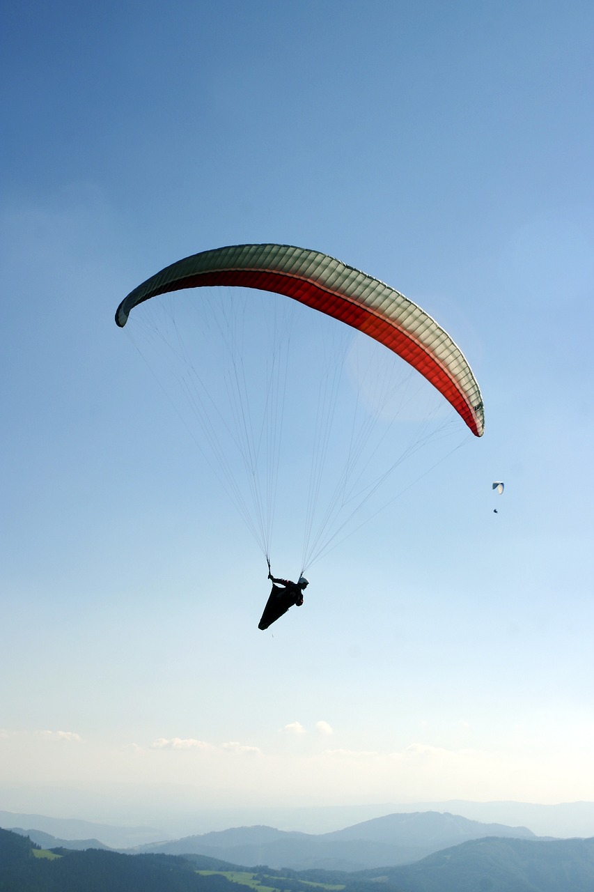 paragliding a parachute the sky free photo