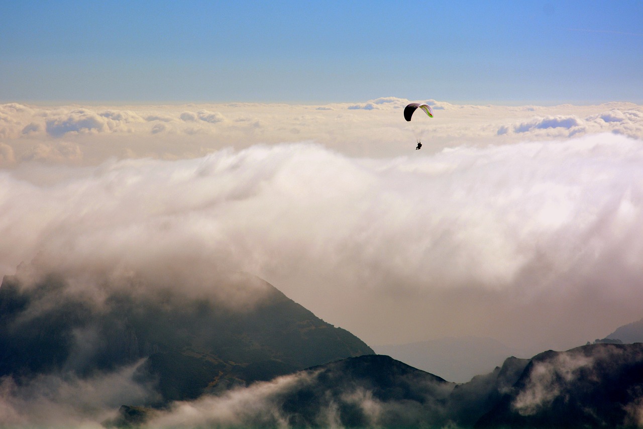 paragliding clouds mountain free photo