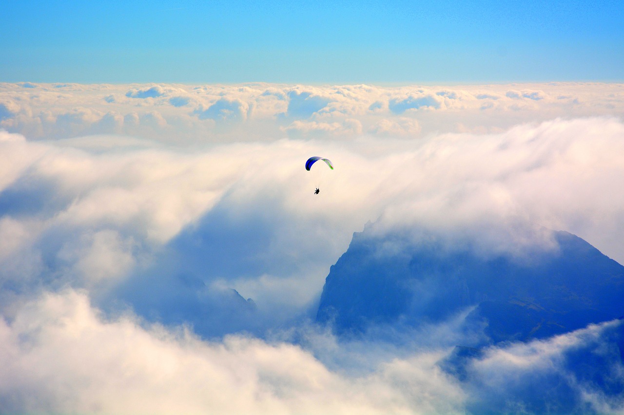 paragliding clouds mountain free photo