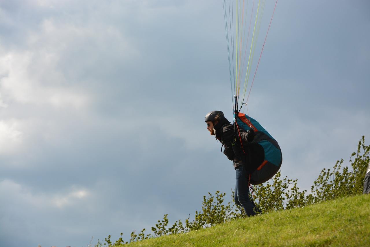 paragliding  paraglider takes to the skies  sports activities free photo