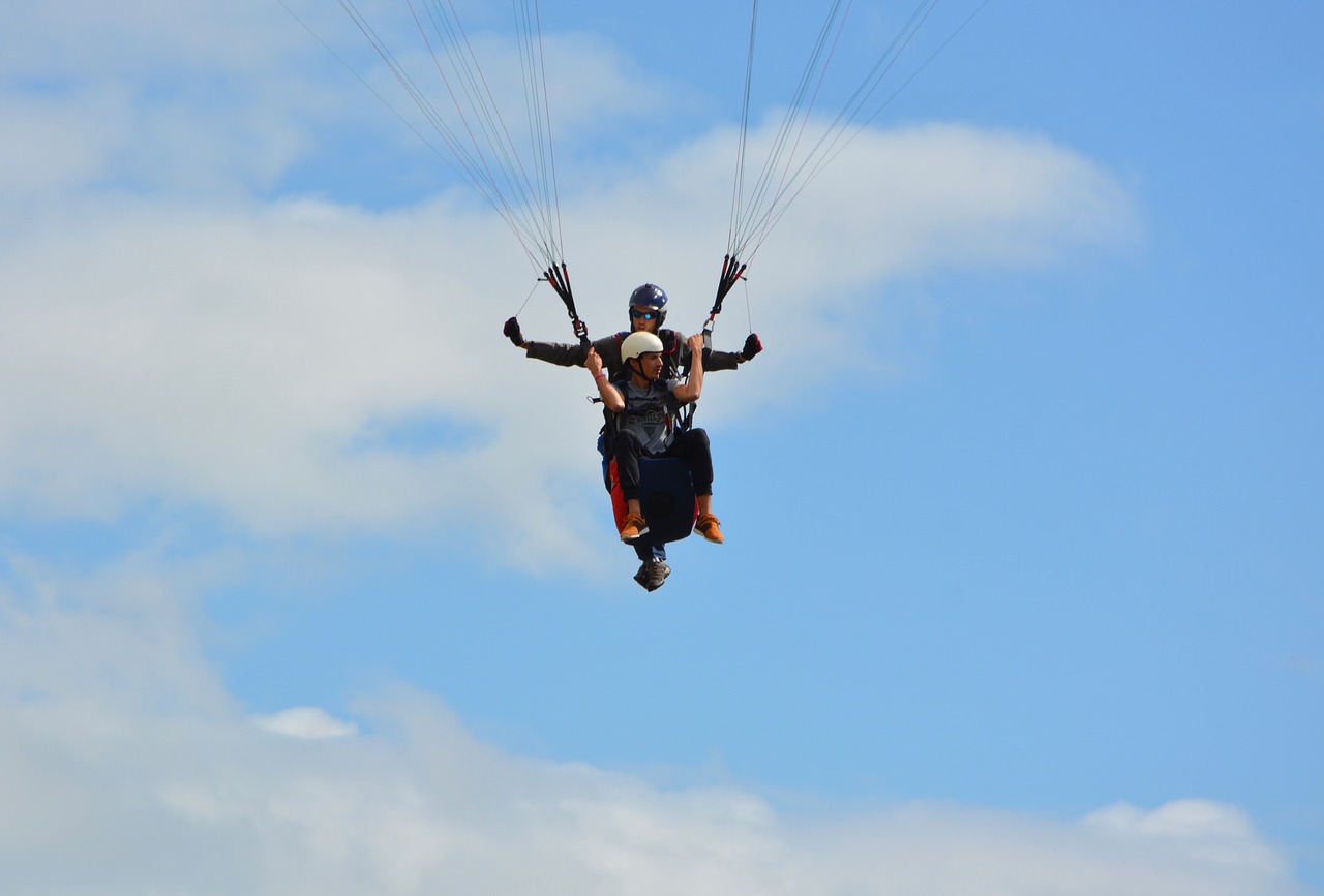 paragliding  tandem paragliding  blue sky free photo