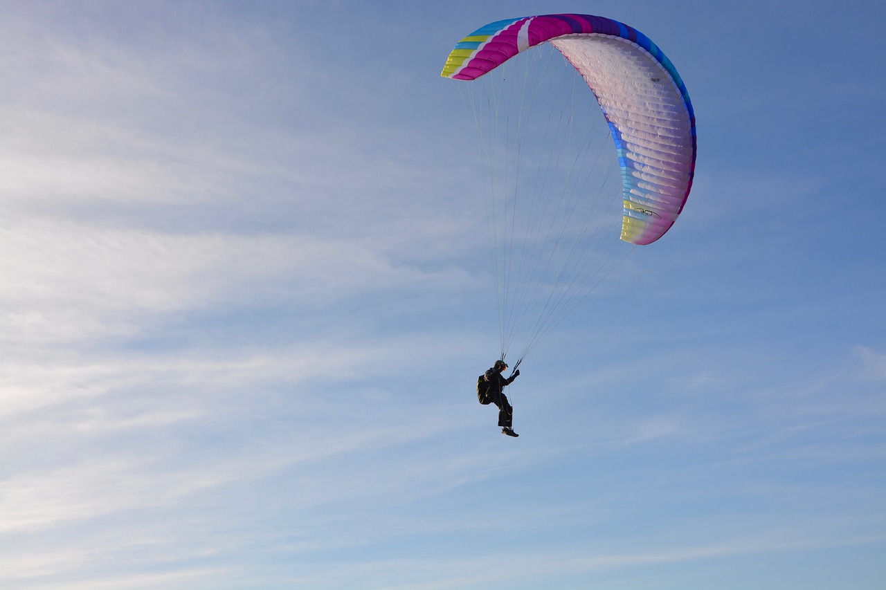 paragliding  paraglider  preparation for landing free photo