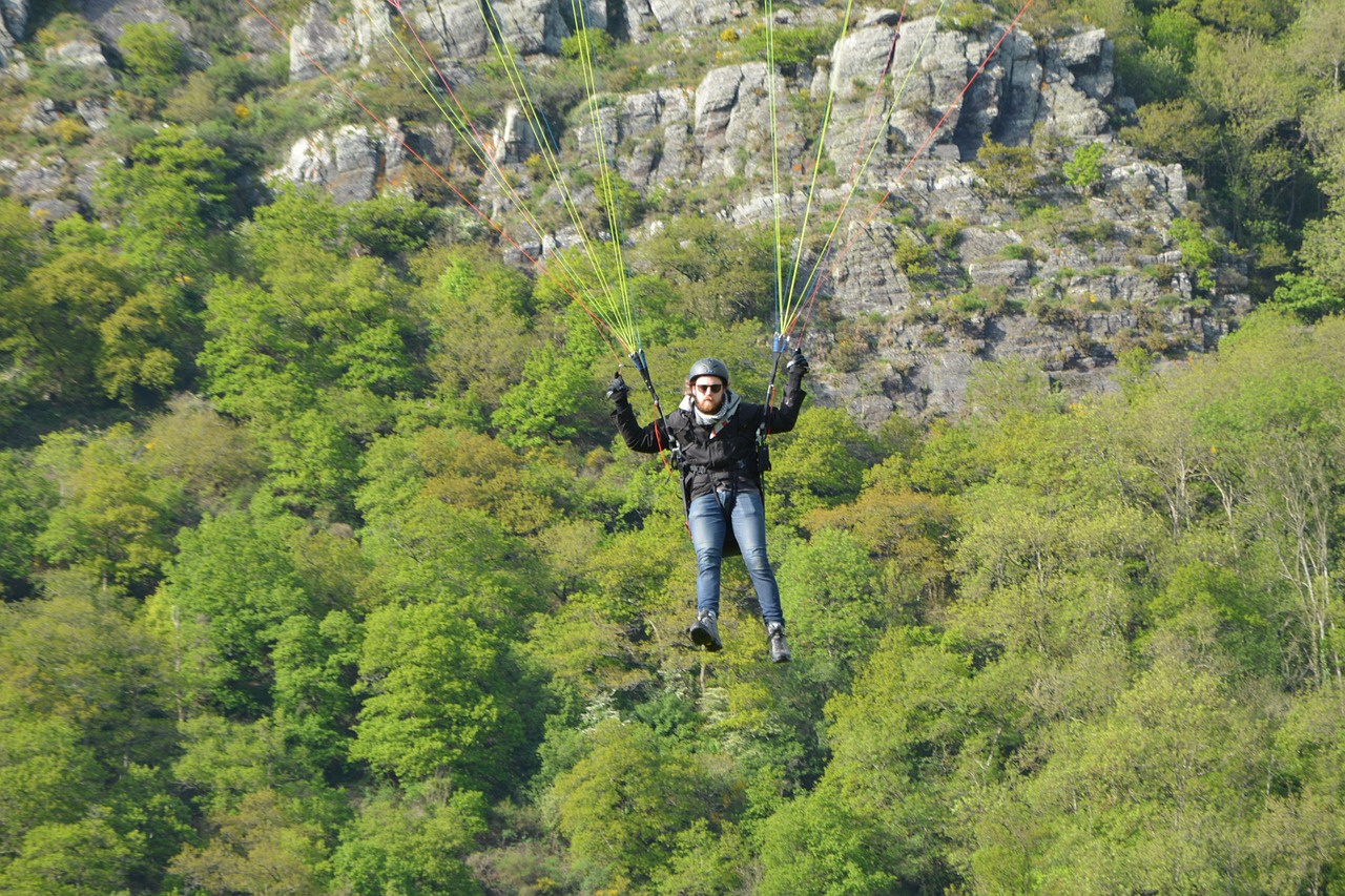 paragliding landing  paraglider arises  fly free photo
