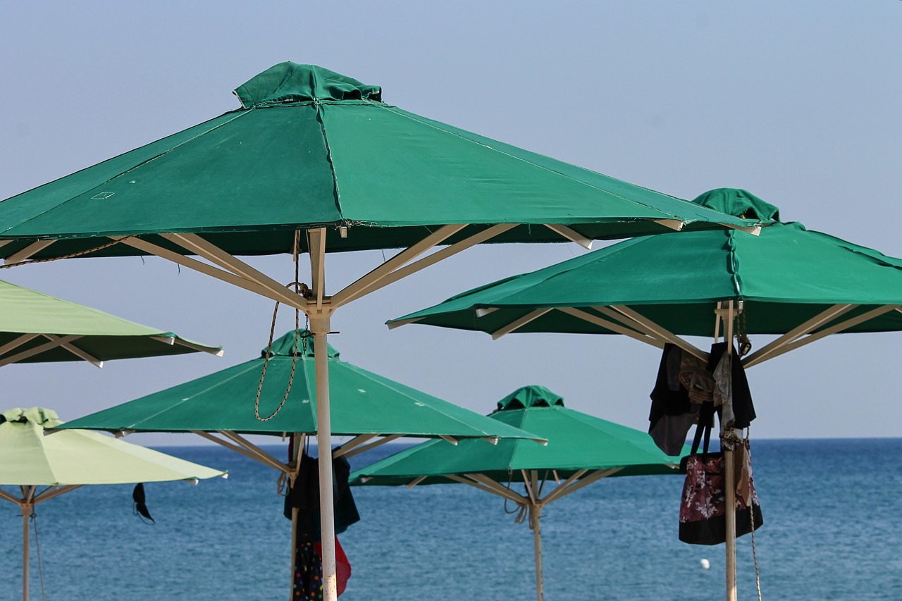 parasols  beach  green free photo