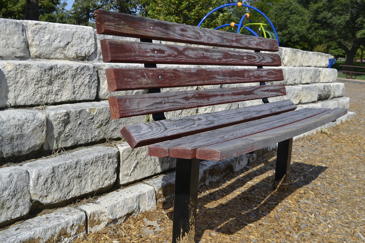 park bench brick wall clean free photo