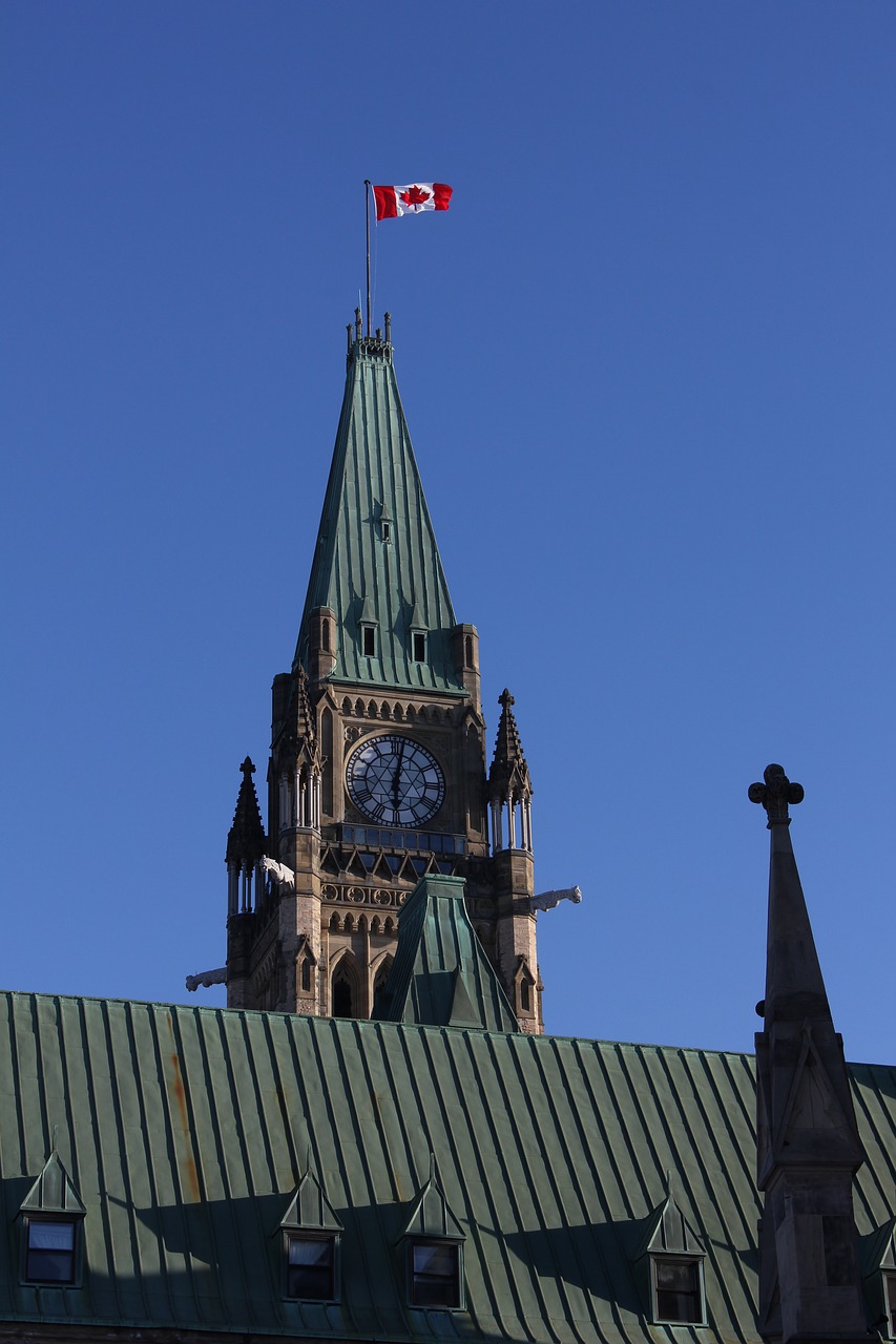 peace tower  parliament of canada  canada flag free photo