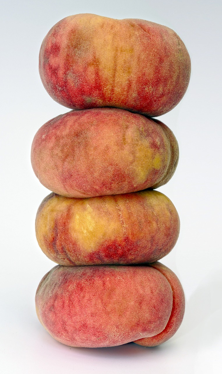 peach one above the other peach tower free photo