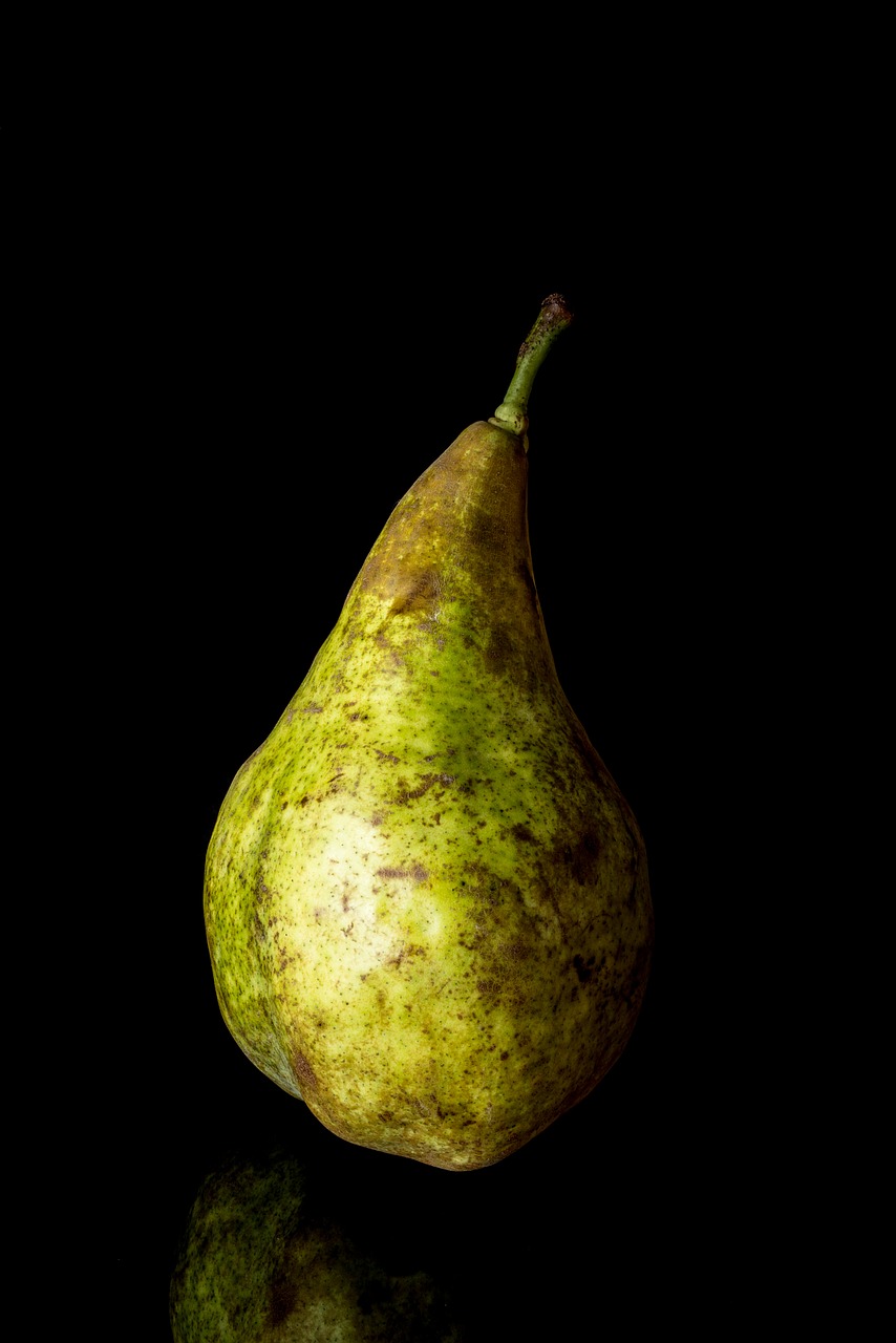pear isolated  isolated  on black background free photo