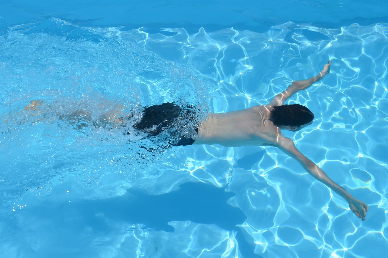 people swimming swimming pool free photo