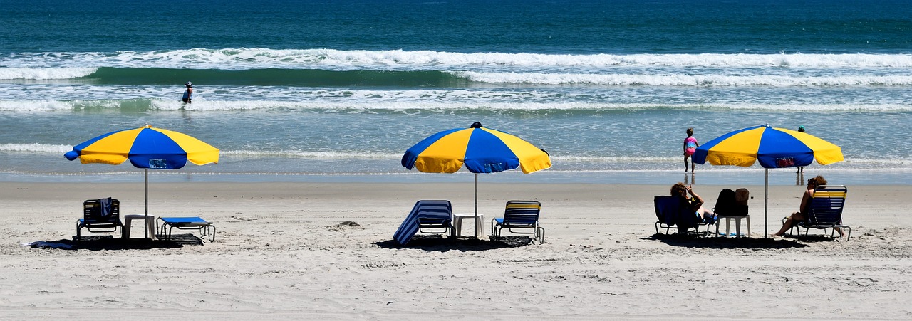 people  beach  beach umbrella free photo