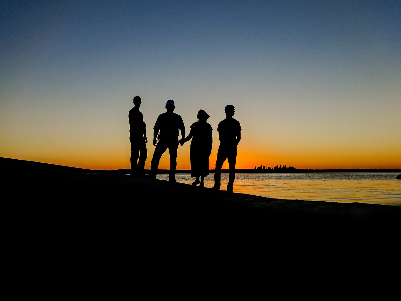 people silhouettes sunset free photo