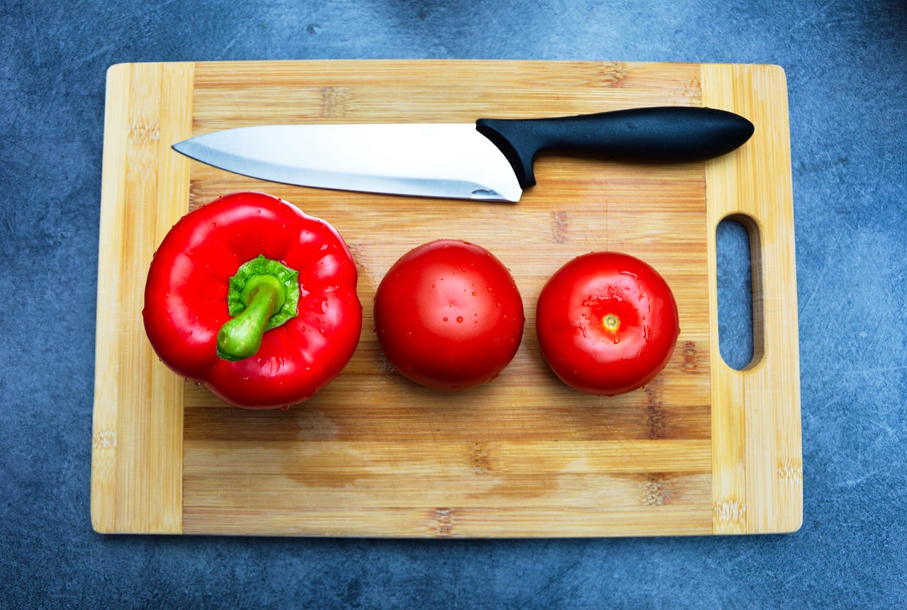 pepper tomatoes cutting board free photo