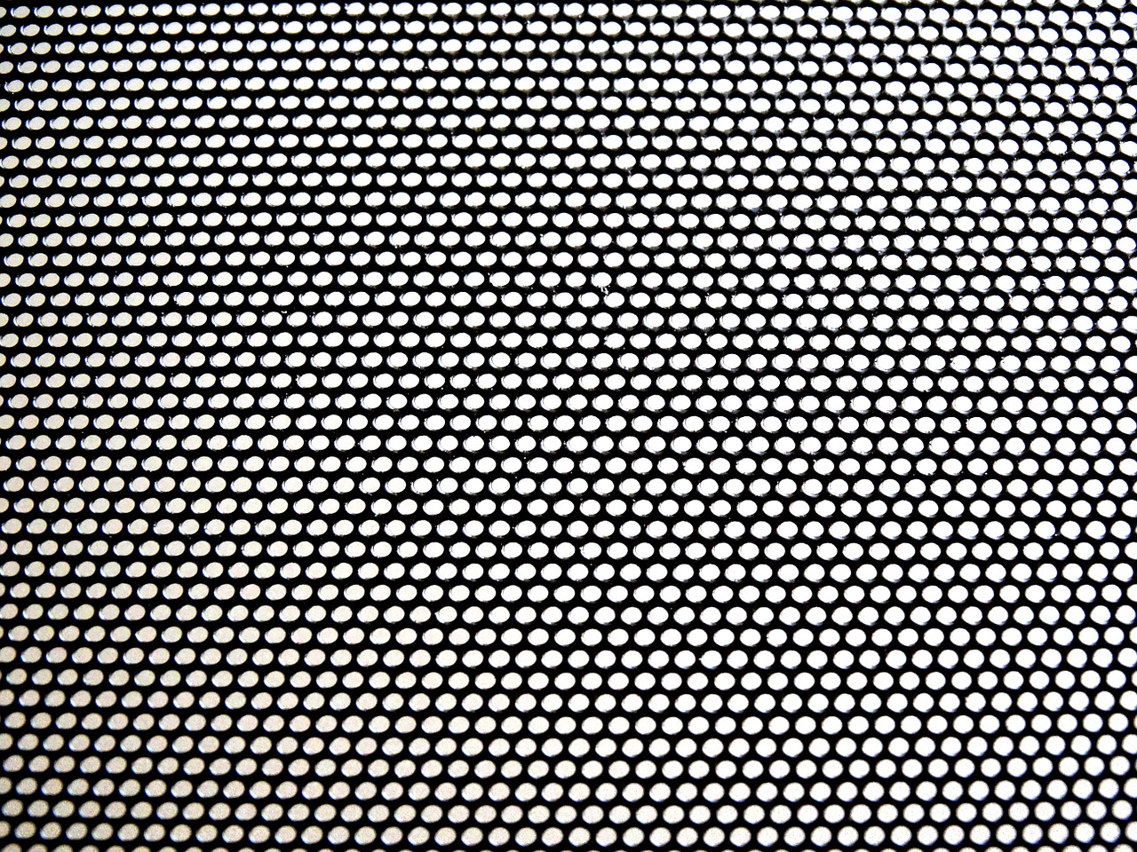 perforated sheet pattern black and white free photo