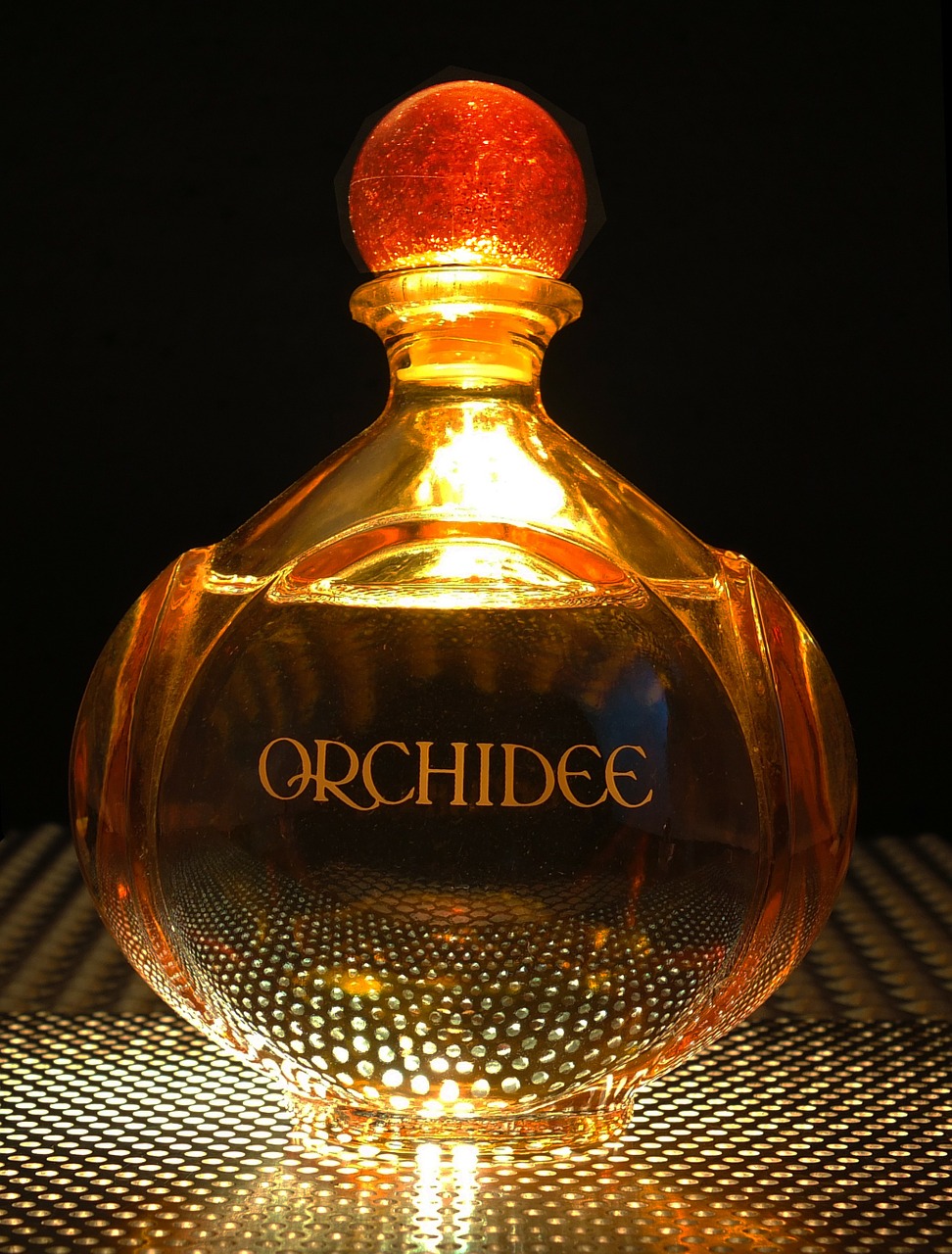 perfume bottle light from below free photo
