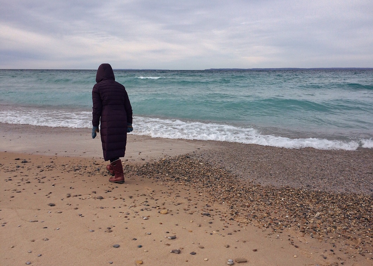 person walking beach shore coast sand free photo