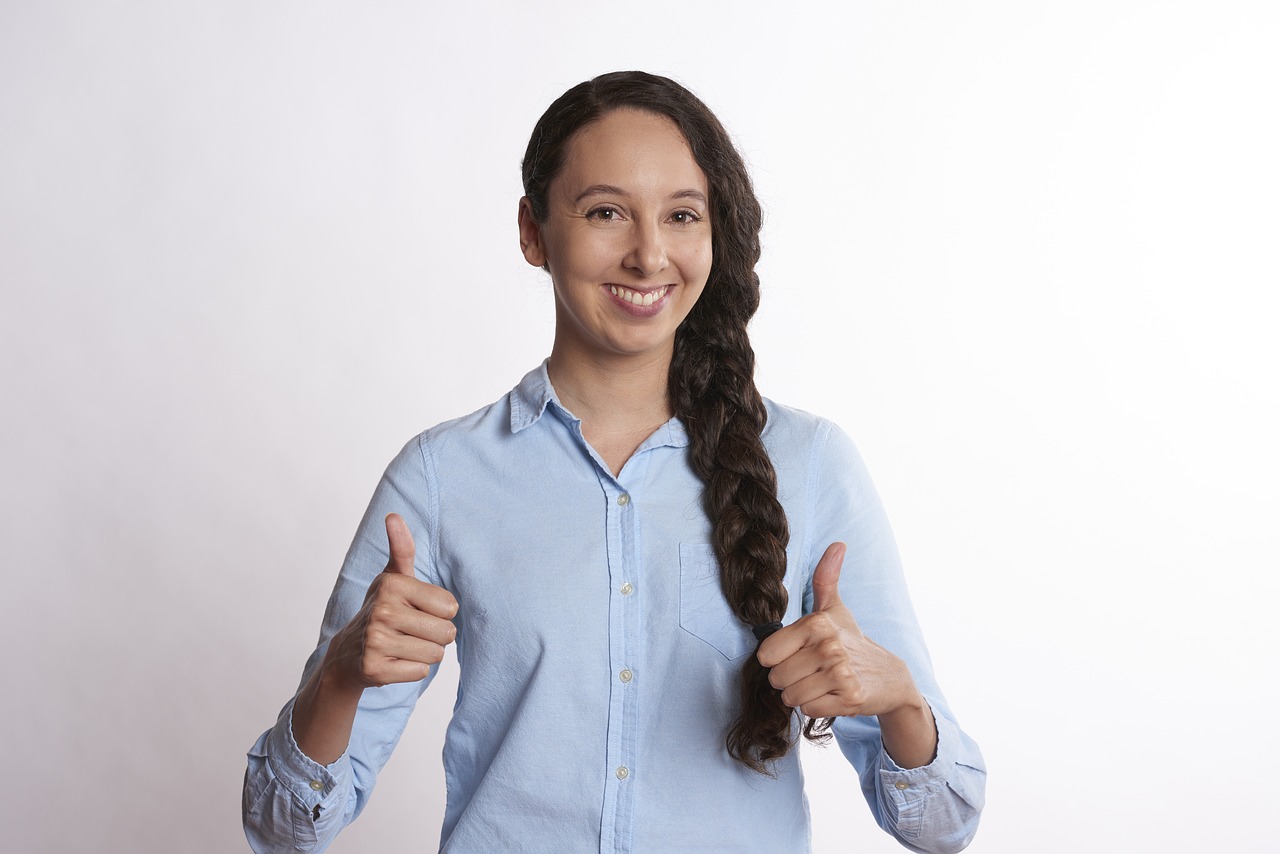person thumbs up smiling free photo