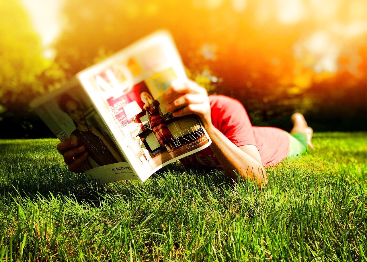 person reading laying free photo