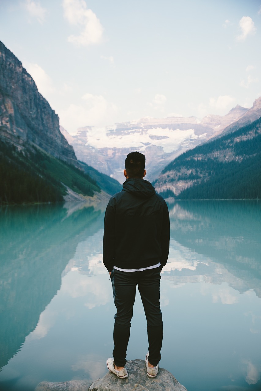 person standing mountains free photo