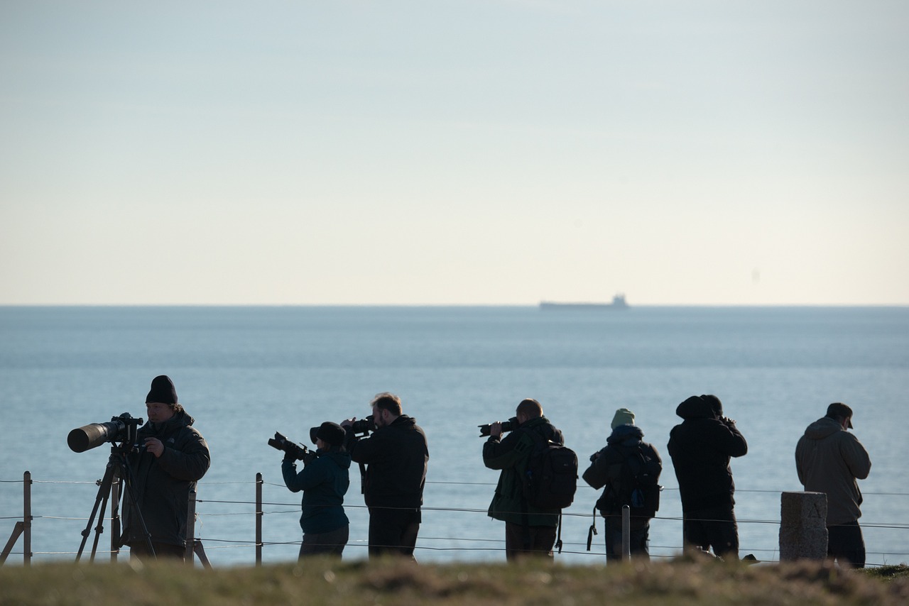 photographer telephoto lenses in action free photo