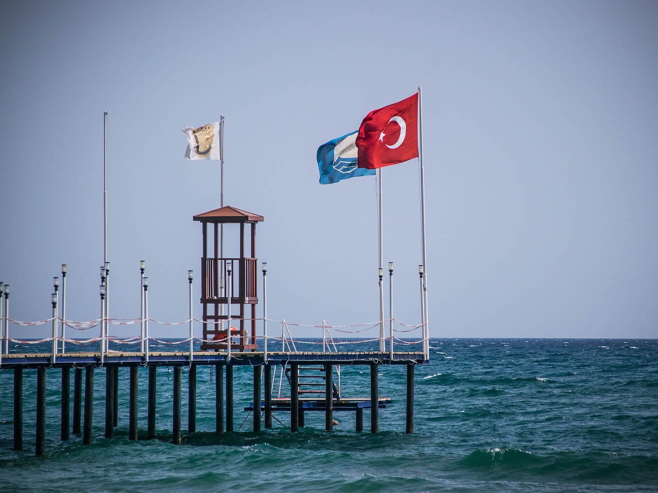 pier  flag  sea free photo