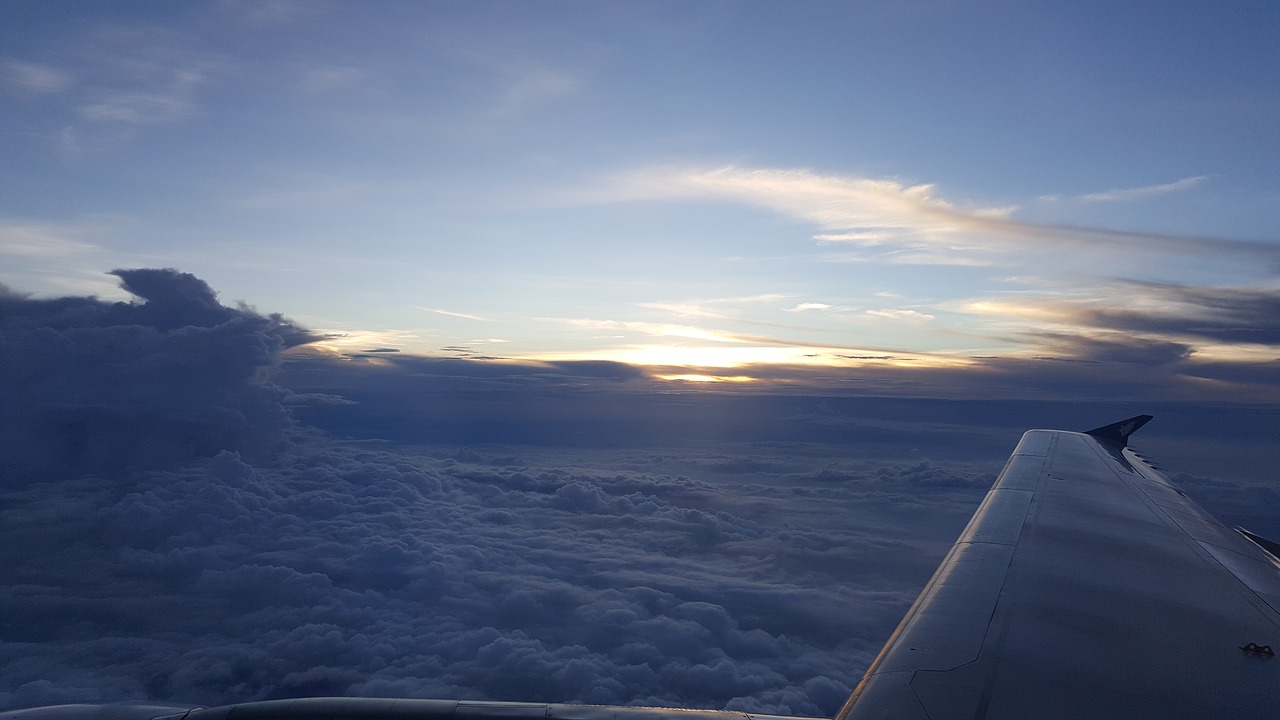 plane sky clouds free photo