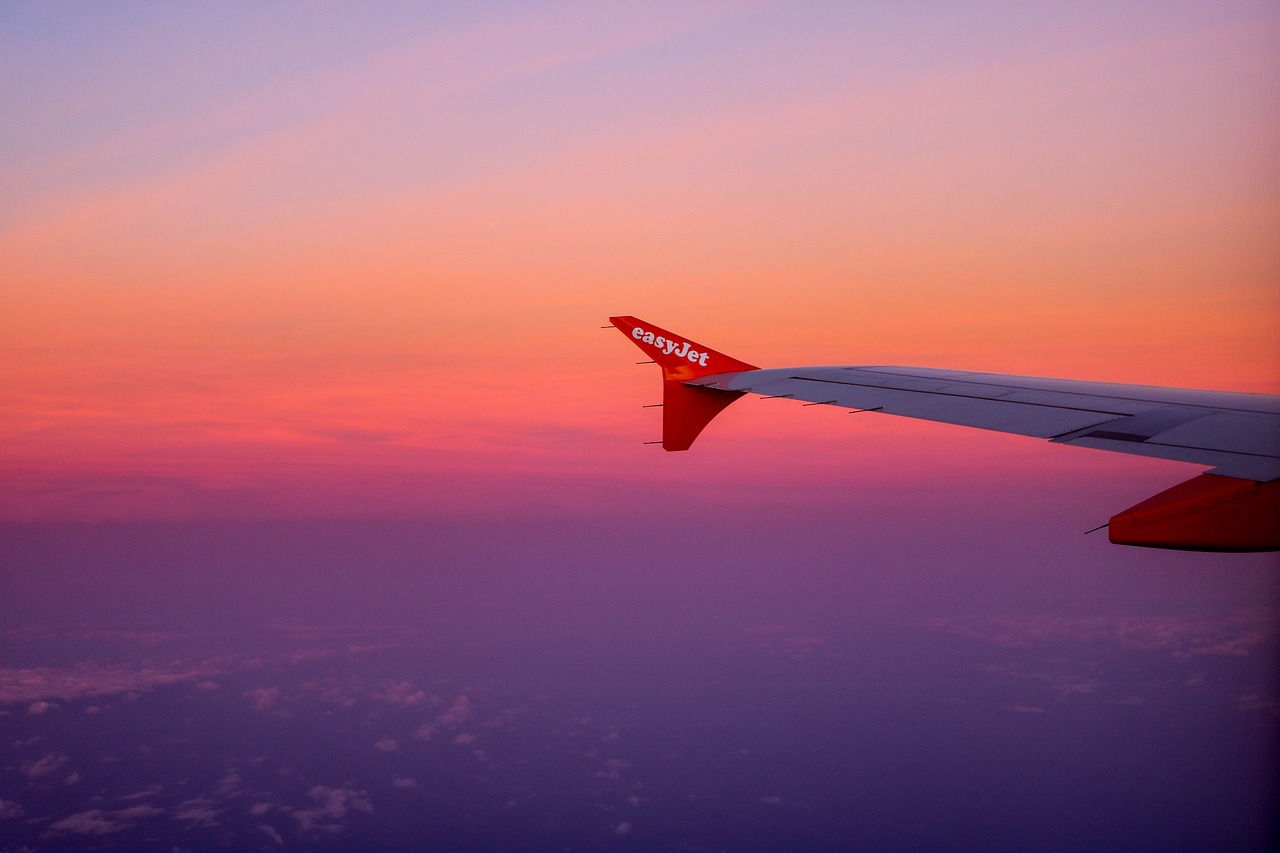 pretty sunset sky with plane