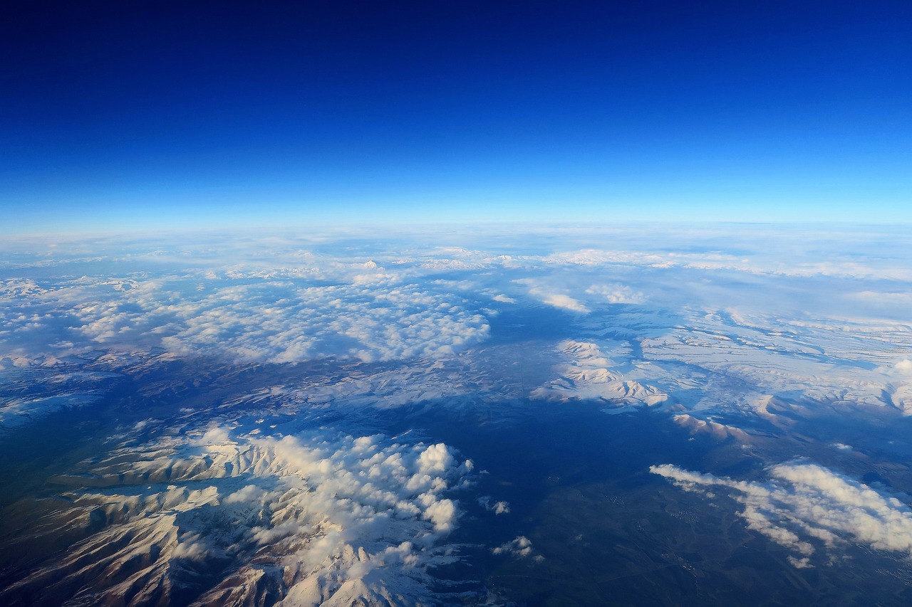 plane clouds mountains free photo