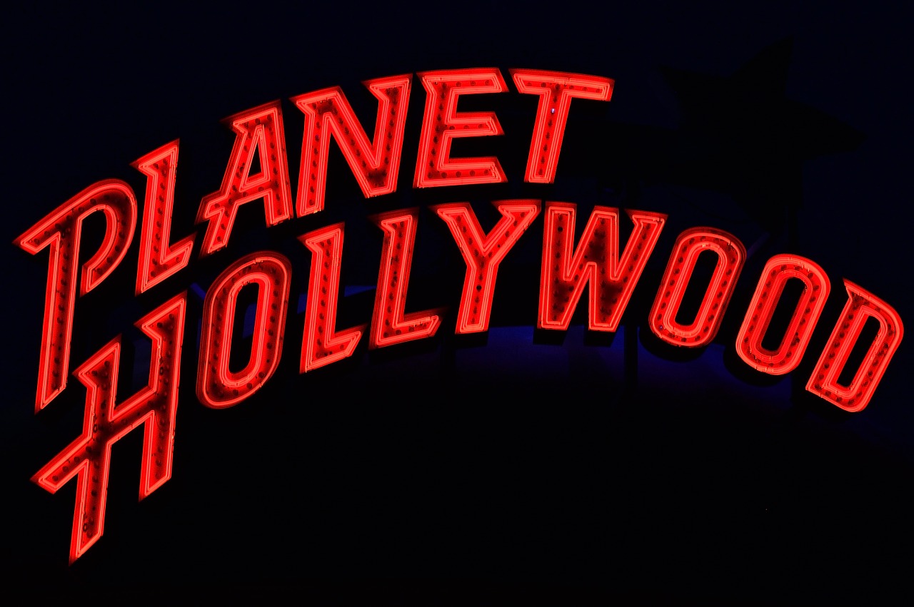 planet hollywood neon advertising free photo