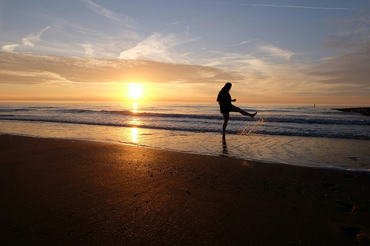 playful beach sunset free photo